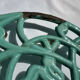 Enamelled cast iron trivet in blue with wrought iron decoration.