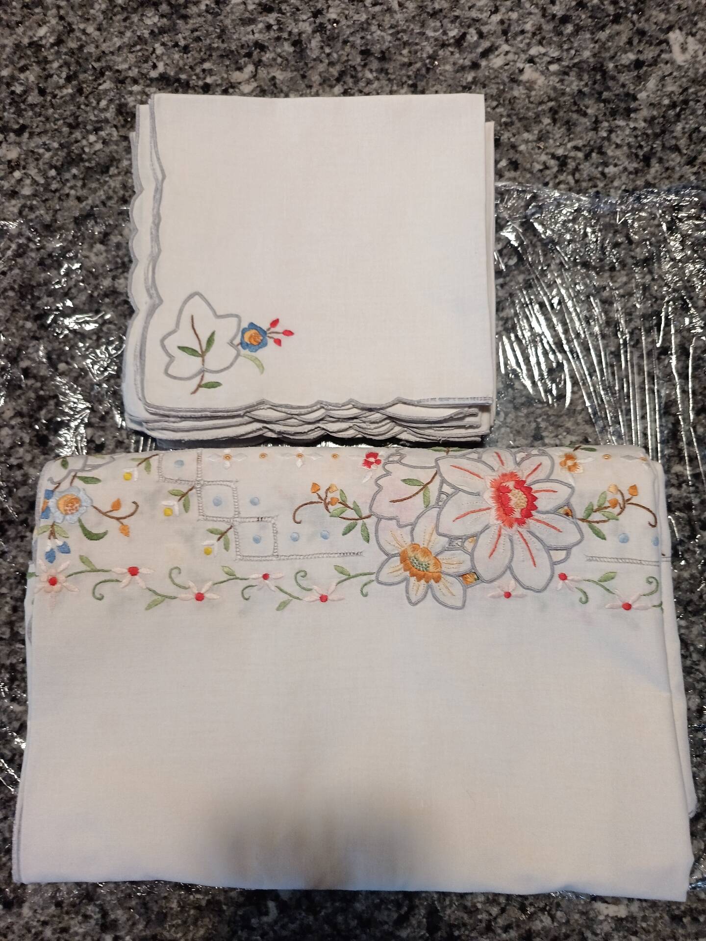 Large old embroidered and openwork tablecloth and 8 napkins.