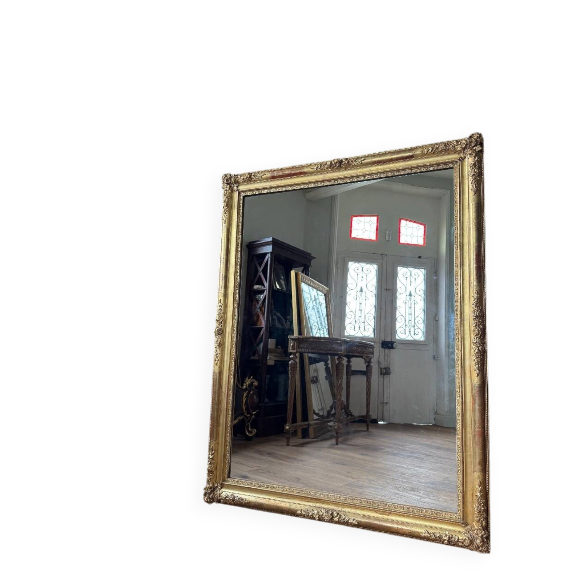 Restoration period mirror in gilded wood from the Napoleonic III era, 165 cm x 130 cm.