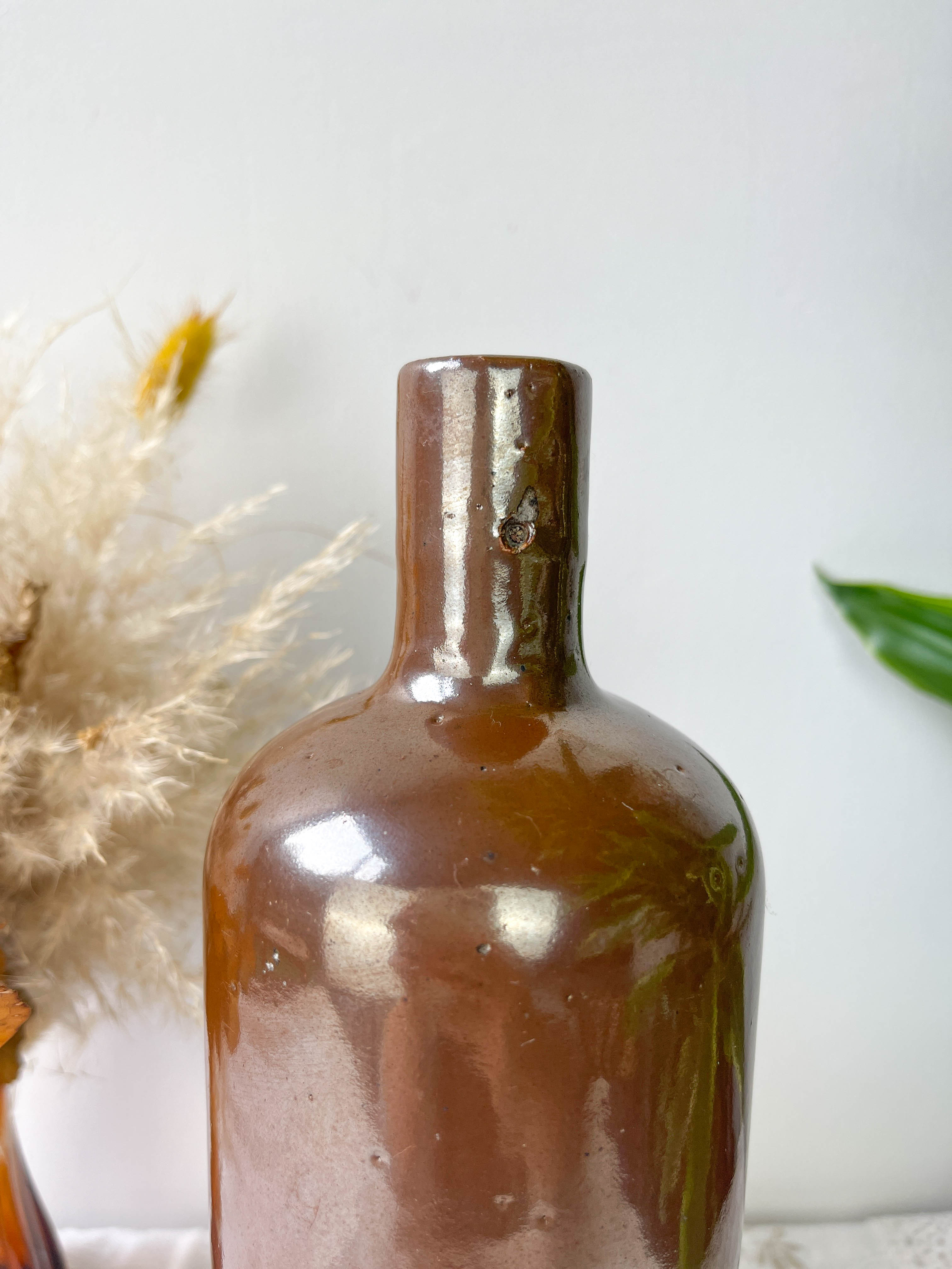 Vintage iridescent brown stoneware bottle