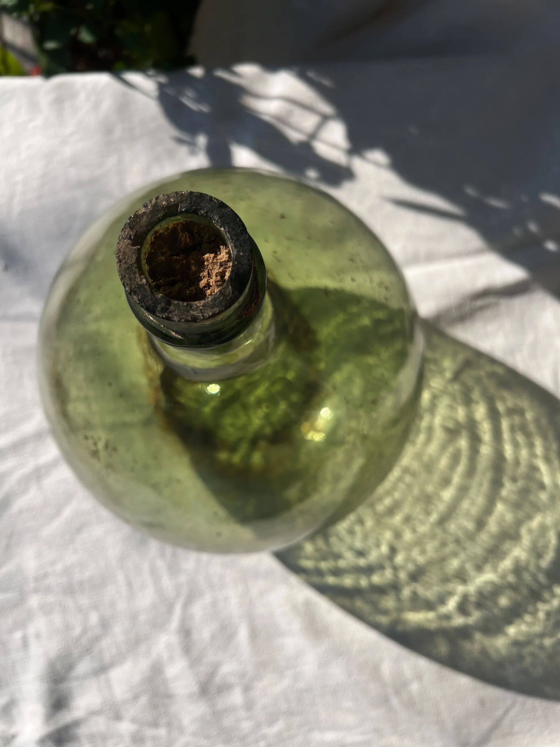 Large French green glass demijohn