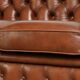 Very spacious 2-seater Chesterfield sofa in cow leather in a English look