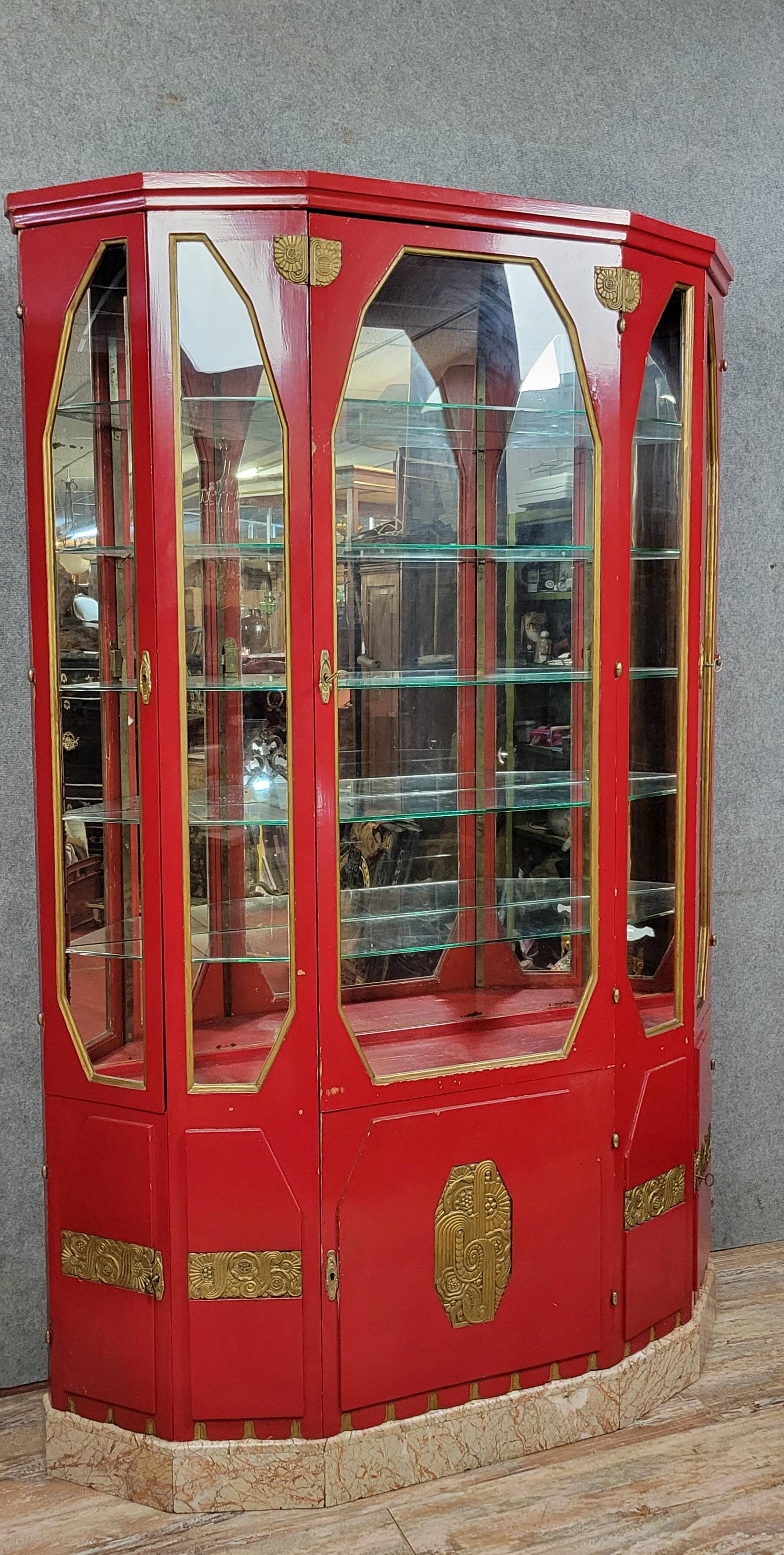 Important Art Deco period bookcase in lacquered wood and gilded bronze
