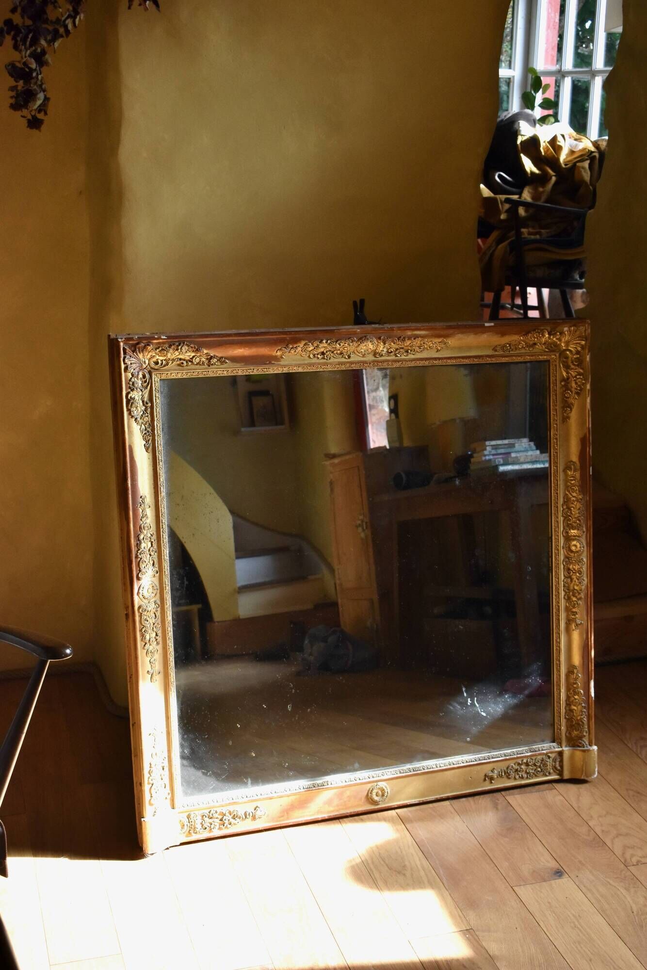 Large gilded Empire mirror from the 19th century.