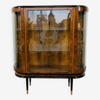 Display case in art deco style with black elements and engraved glass