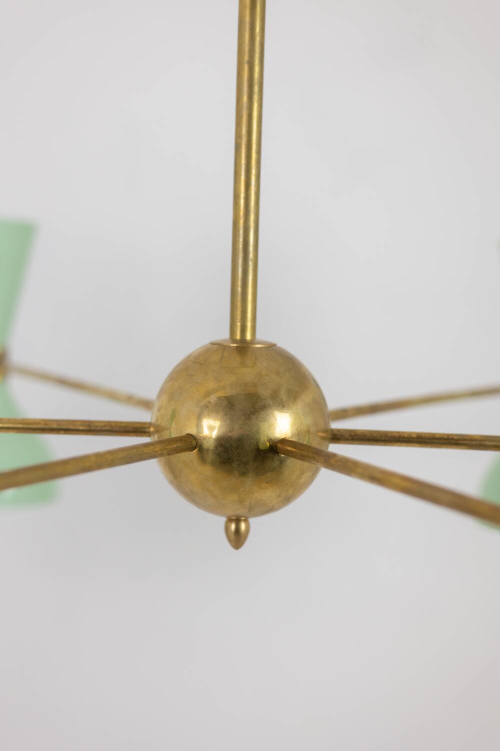 Contemporary 12-light diabolo-shaped radiant chandelier.