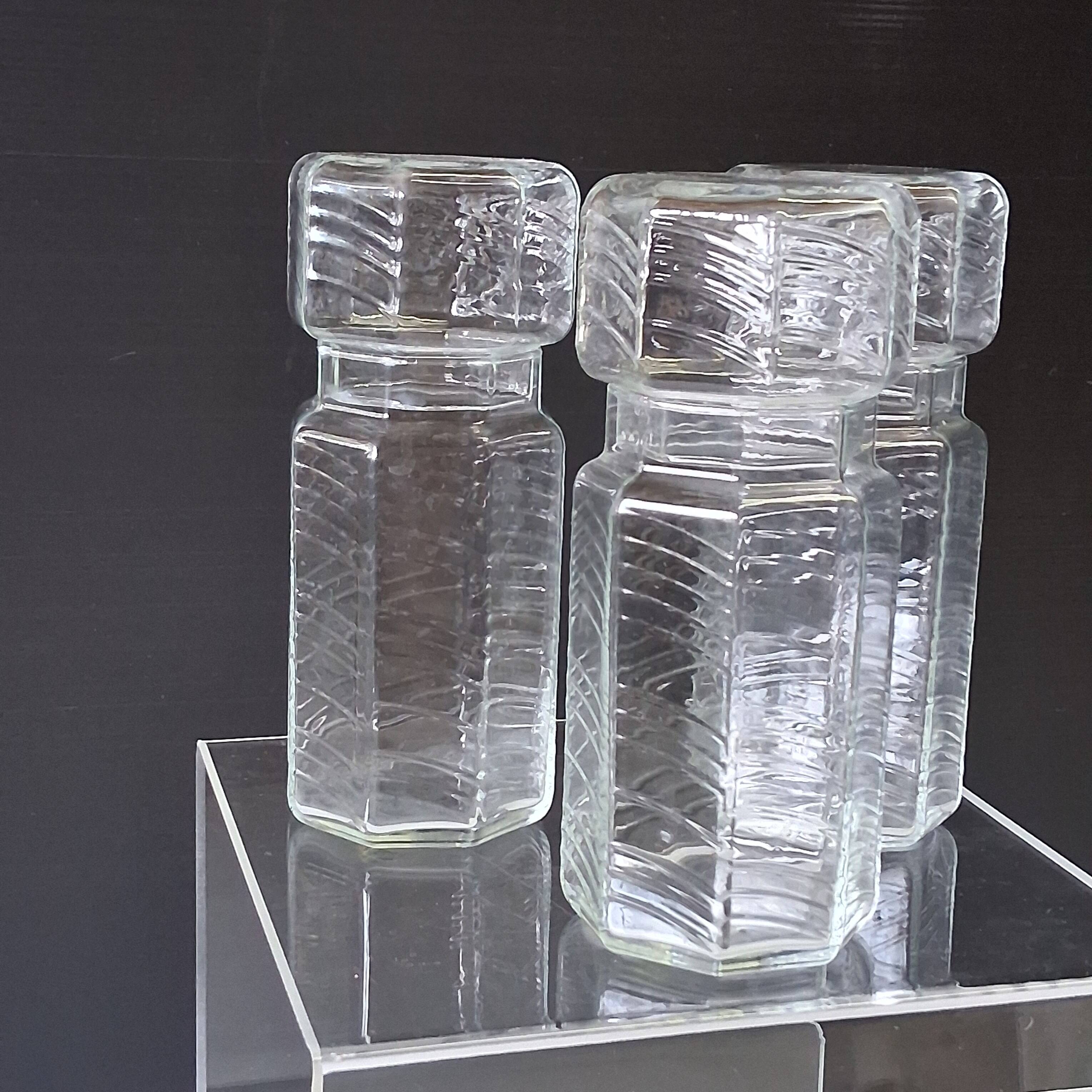 Set of 3 glass jars with old transparent lids in very good condition.