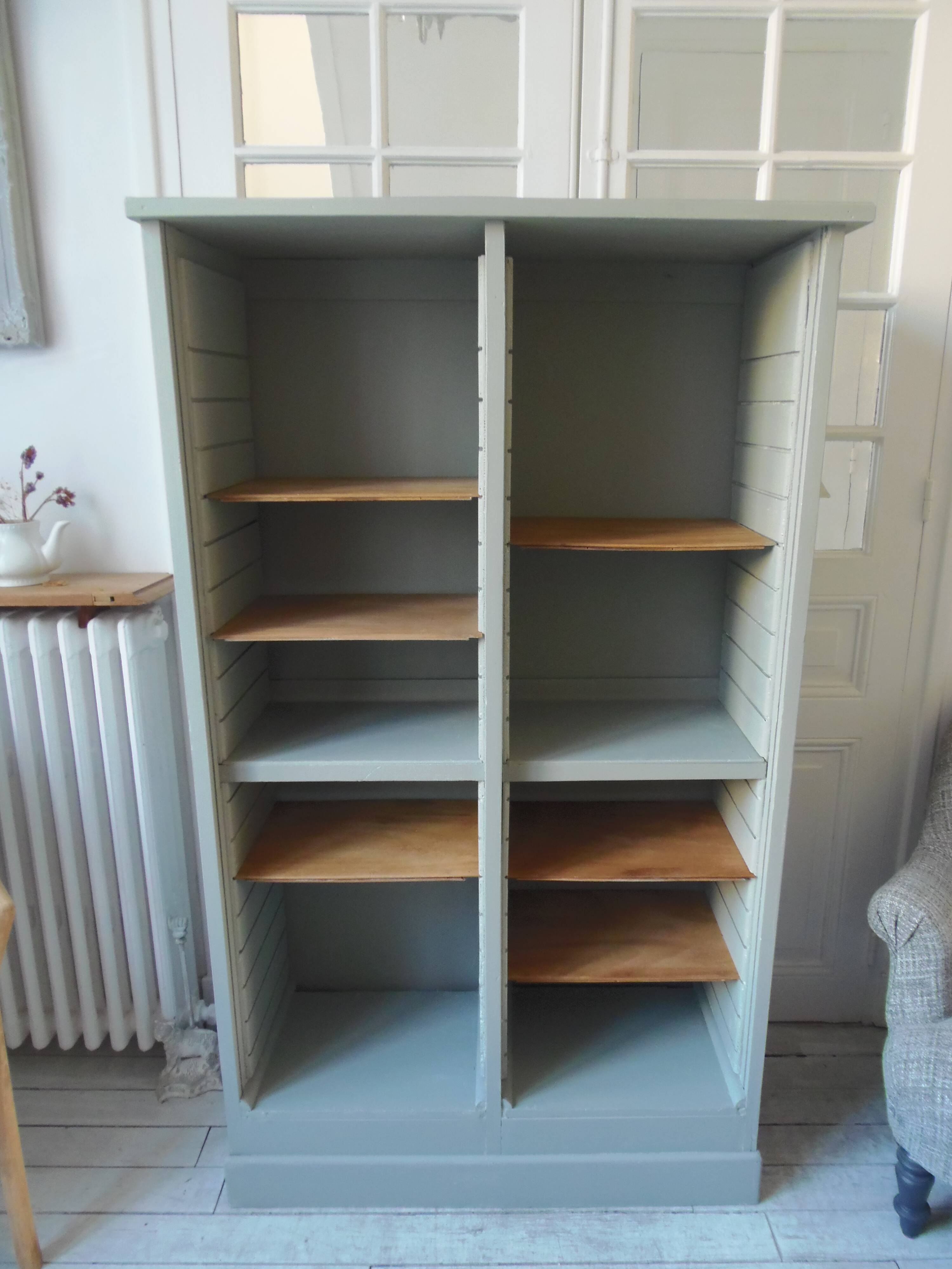 Vintage furniture transformed into a bookcase, verdigris patinated sideboard.