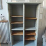 Vintage furniture transformed into a bookcase, verdigris patinated sideboard.