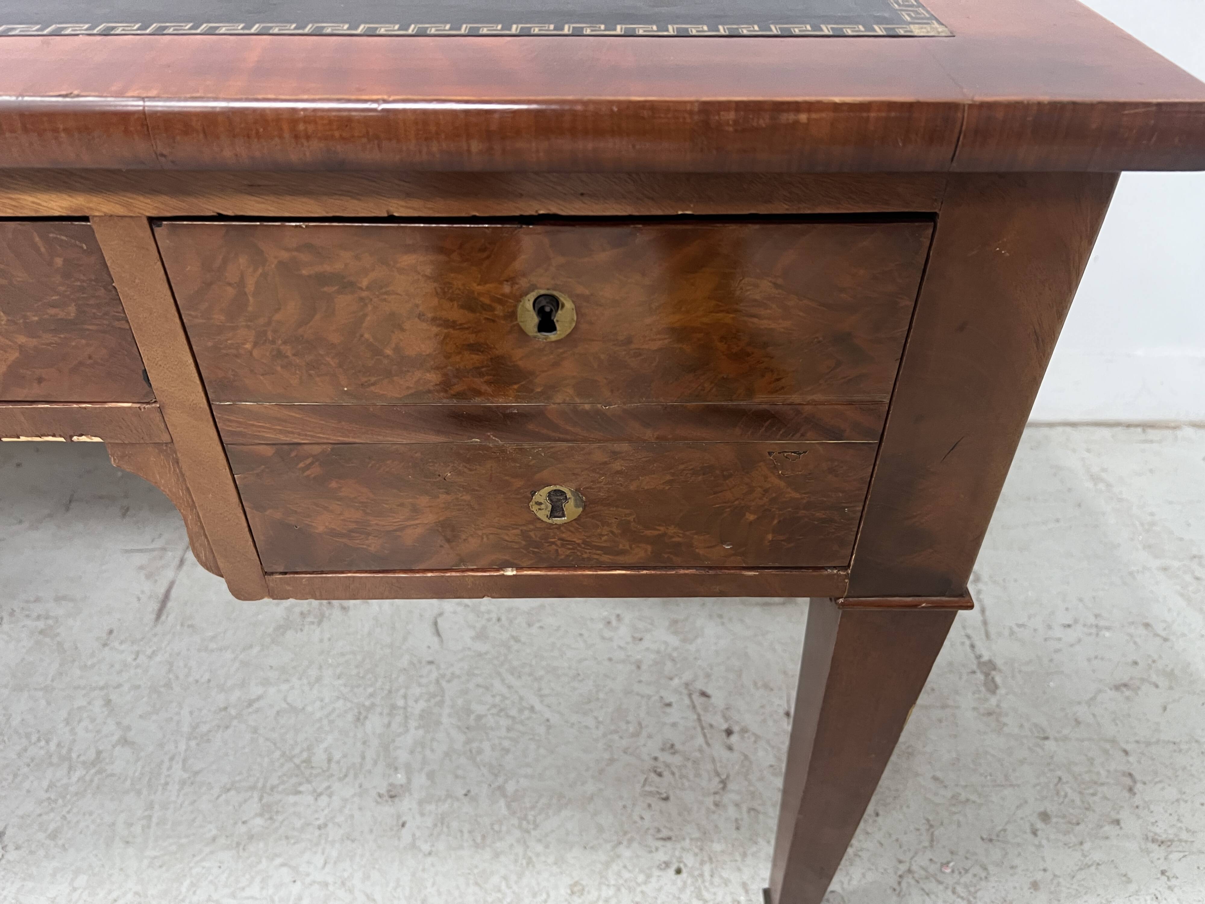 Louis XVI style flat desk in walnut and veneer, 19th century.