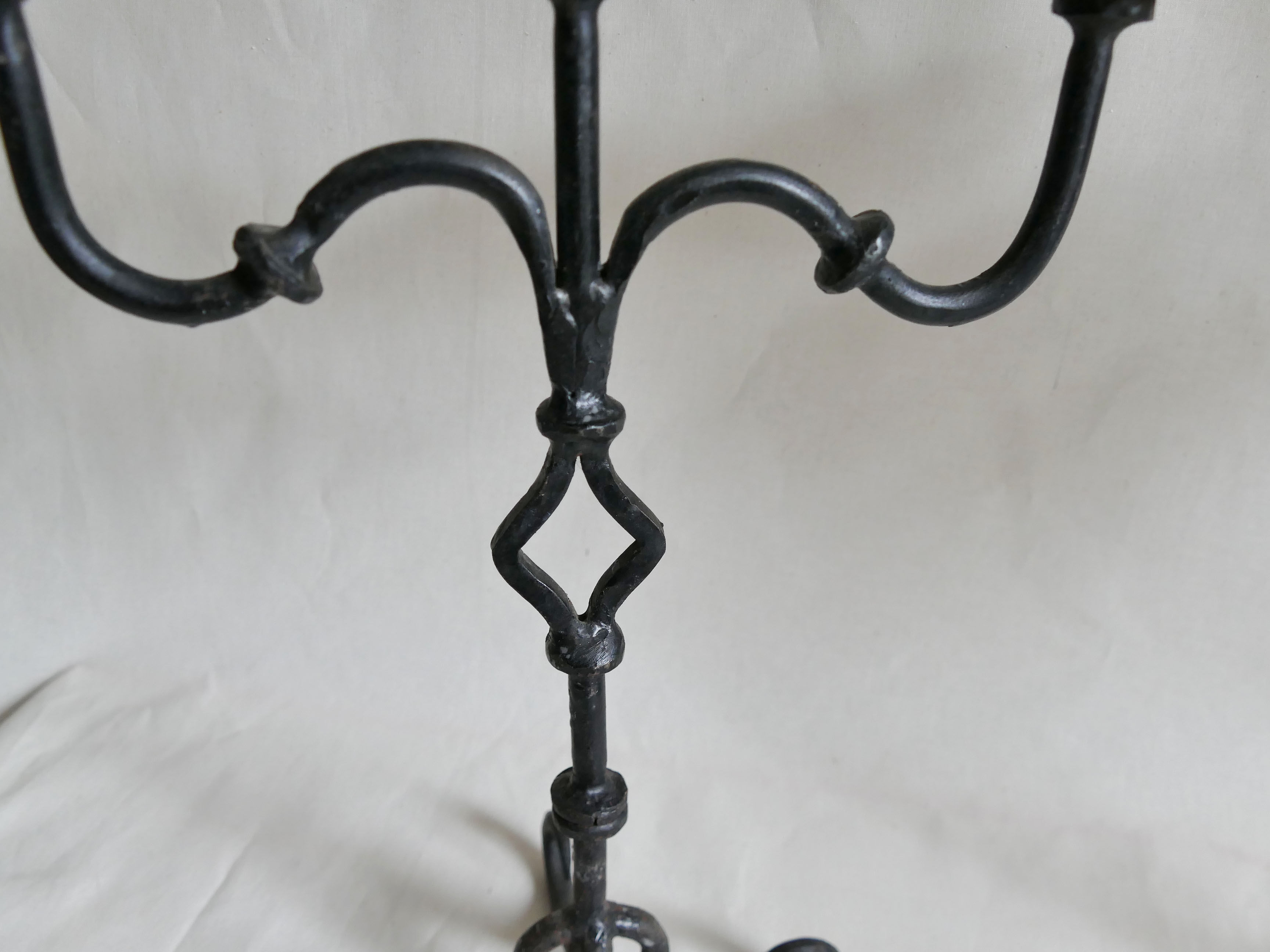 Pair of antique wrought iron chandeliers