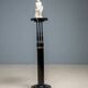 Black lacquered pedestal with brass details, 20th century