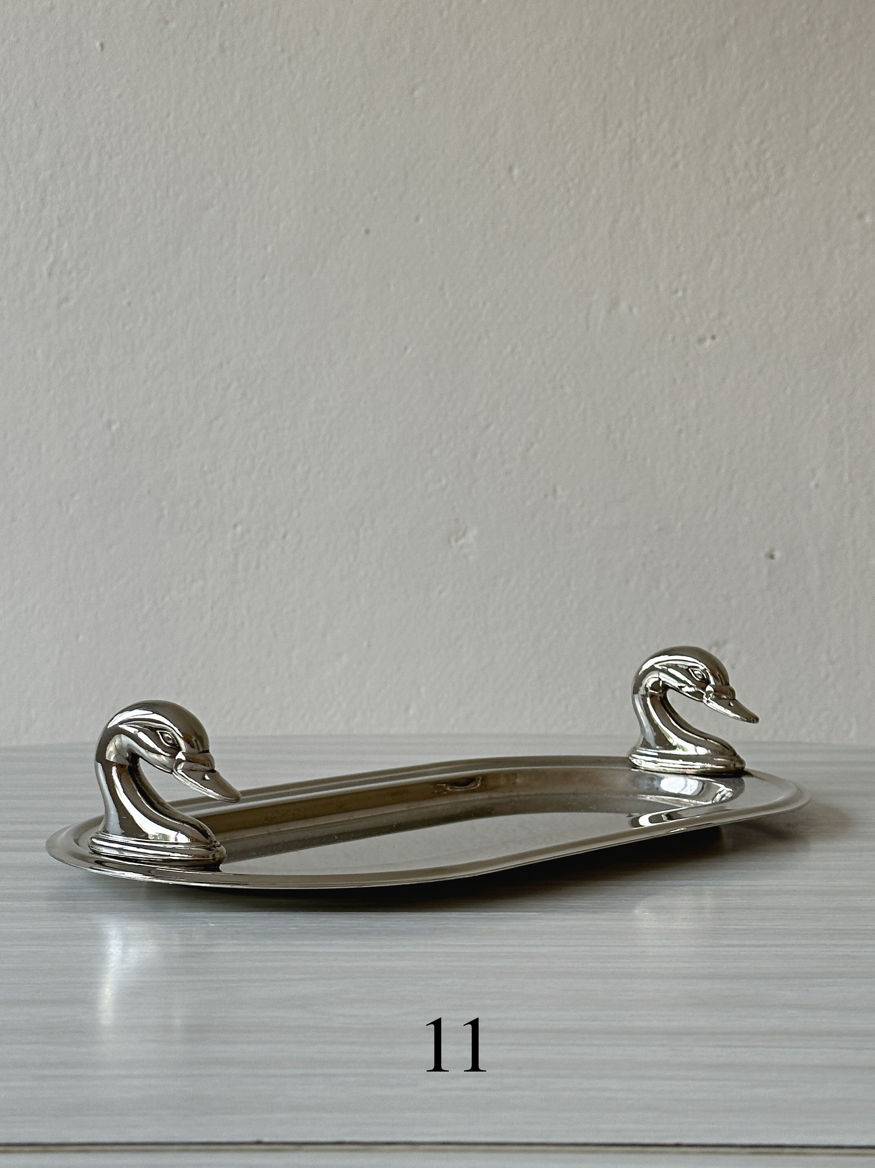 Metal dish with goose head handles serving tray