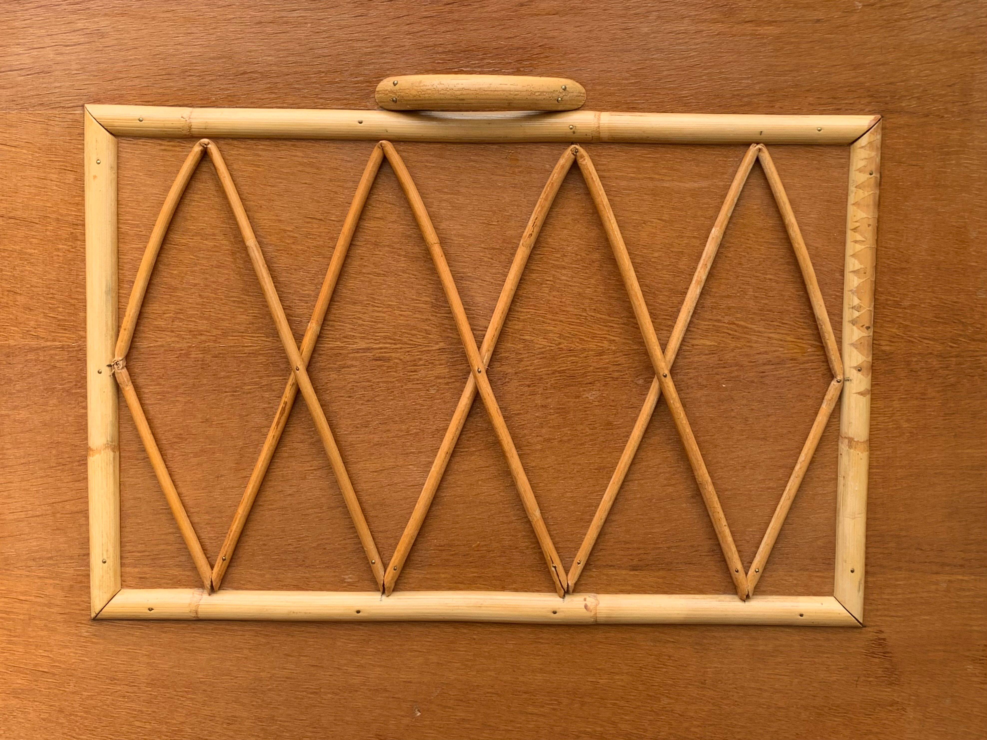 Rattan wardrobe with tapered legs from the 1960s.