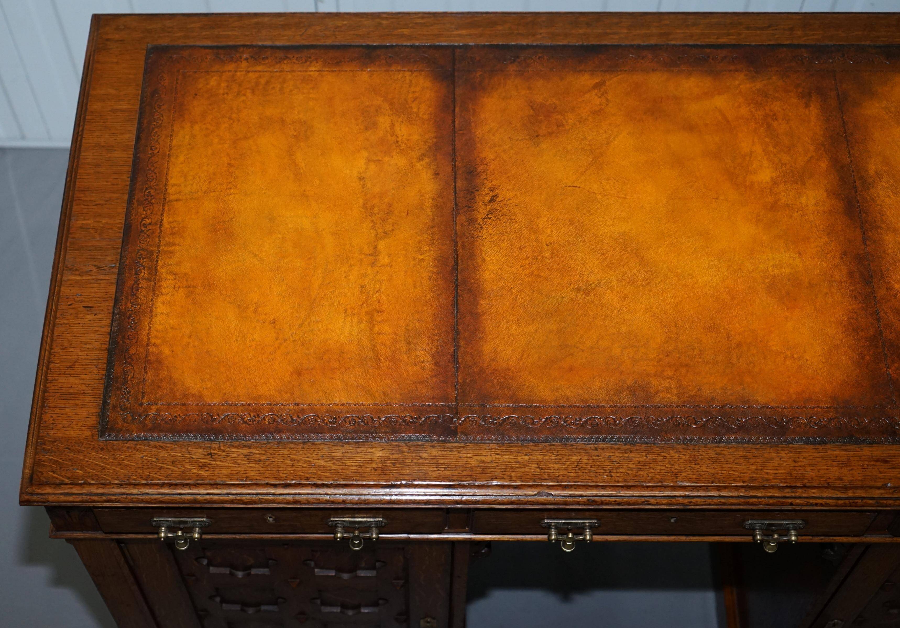 Restored Gothic desk with side bookshelves, drawer, and sloping top by Pugin Gillows.