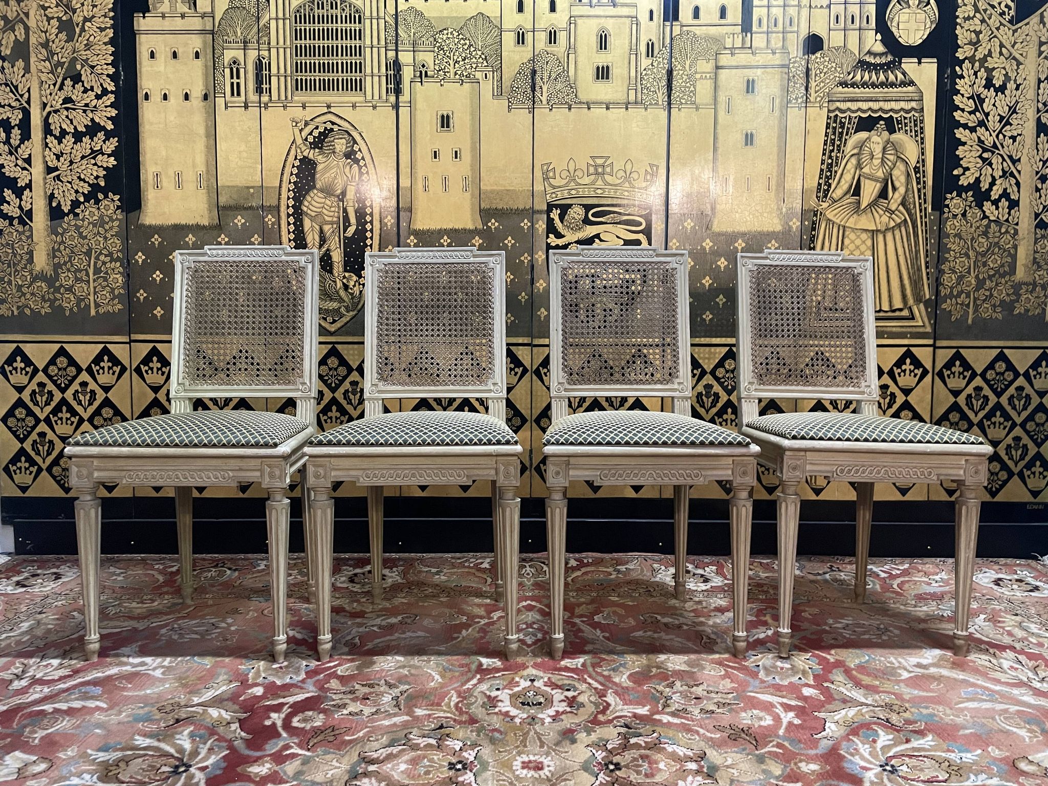 Suite de 4 chaises cannées style Louis XVI Jean Mocque