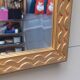 Miroir dore de style art-deco ( 1925-1945) avec  glace biseautee