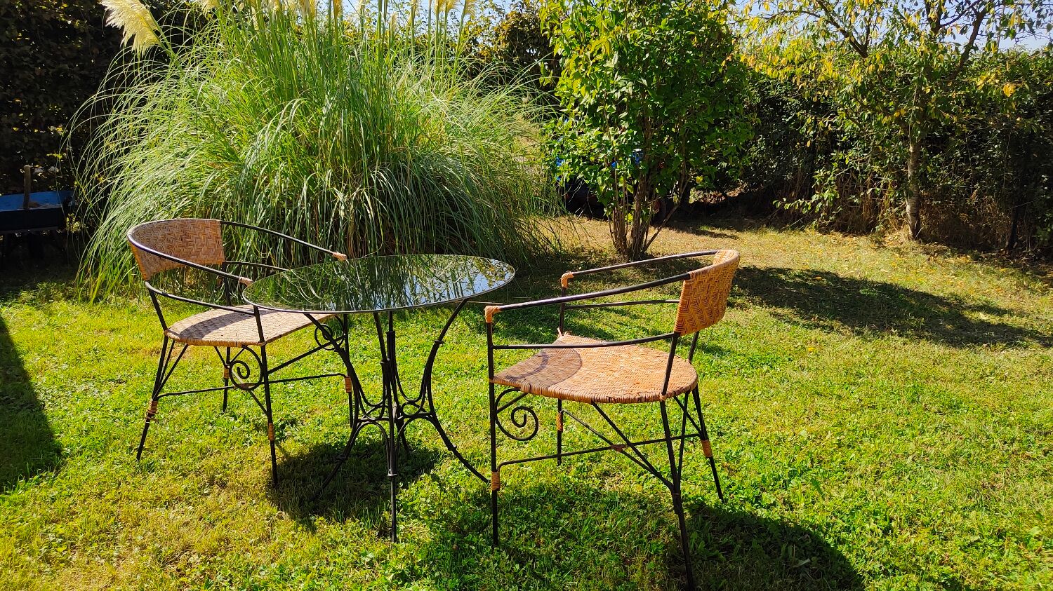 Garden table and wrought iron chair