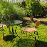 Garden table and wrought iron chair