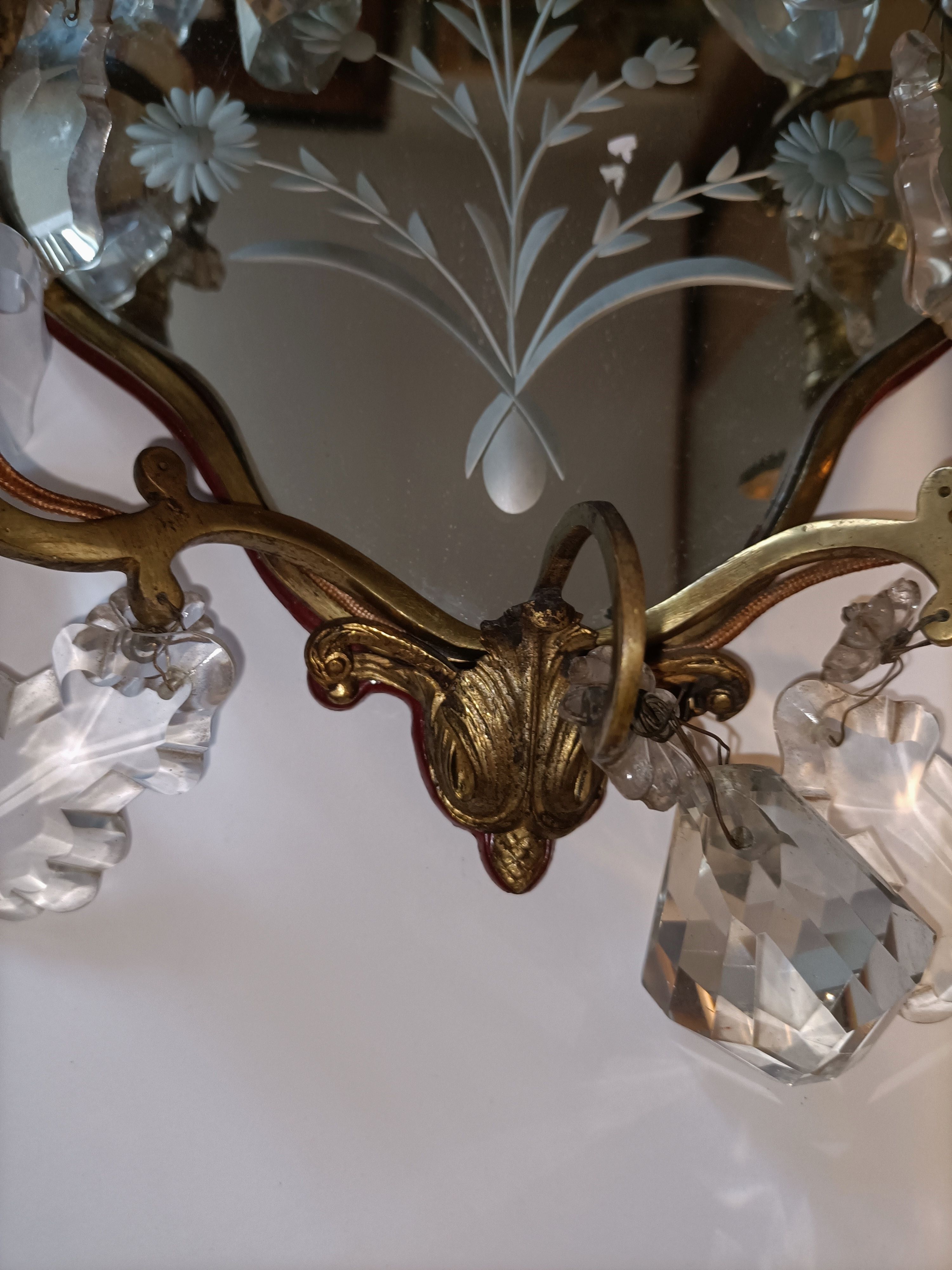 Pair of mirror sconces with two arms of light with gilded brass grapevines, Italy 1960.