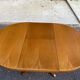 Baumann round extendable Scandinavian dining table with central leg, 1960s oak