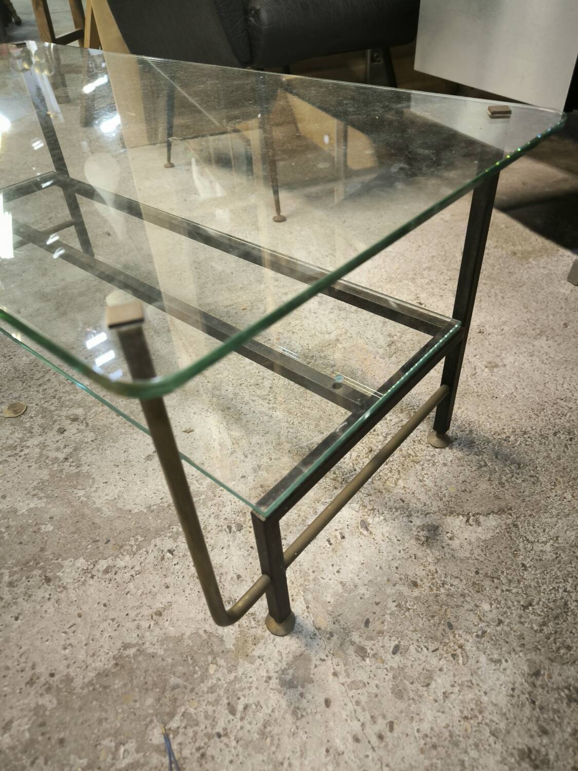 Double-tier coffee table in steel and bronze as well as glass