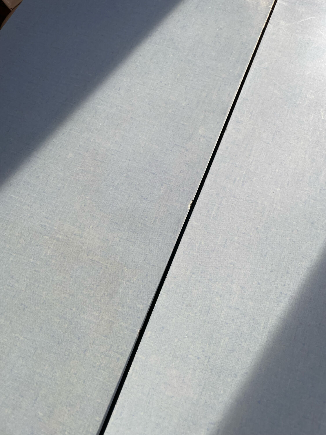 Blue Formica table for 4 to 6 people