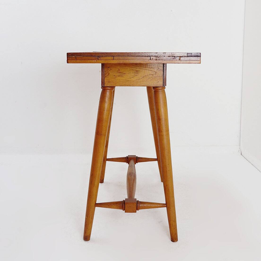 Vintage wooden side table with terracotta top