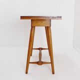 Vintage wooden side table with terracotta top