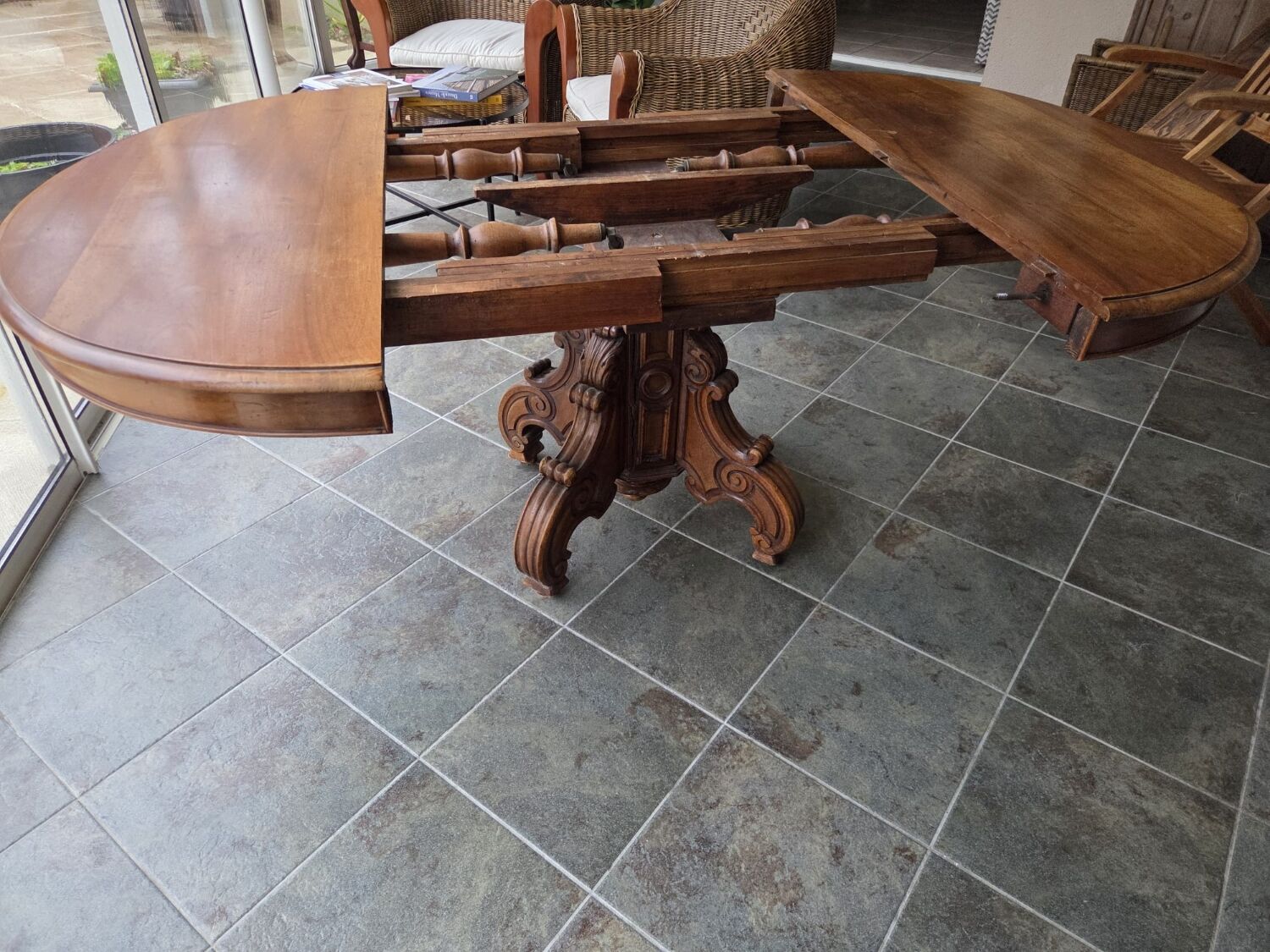 Extendable walnut table in the Napoleon III style.