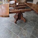 Extendable walnut table in the Napoleon III style.