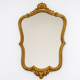 Golden wooden wall mirror in Louis XV style, shell-shaped rocaille decoration, circa