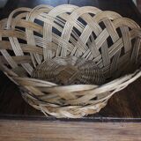 Large vintage twisted wicker basket on a stand