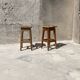 Pair of vintage wooden workshop stools with a patina.