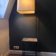 Modernist floor lamp with shelf and magazine holder.