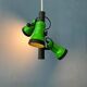 Vintage pendant light with three green spots.