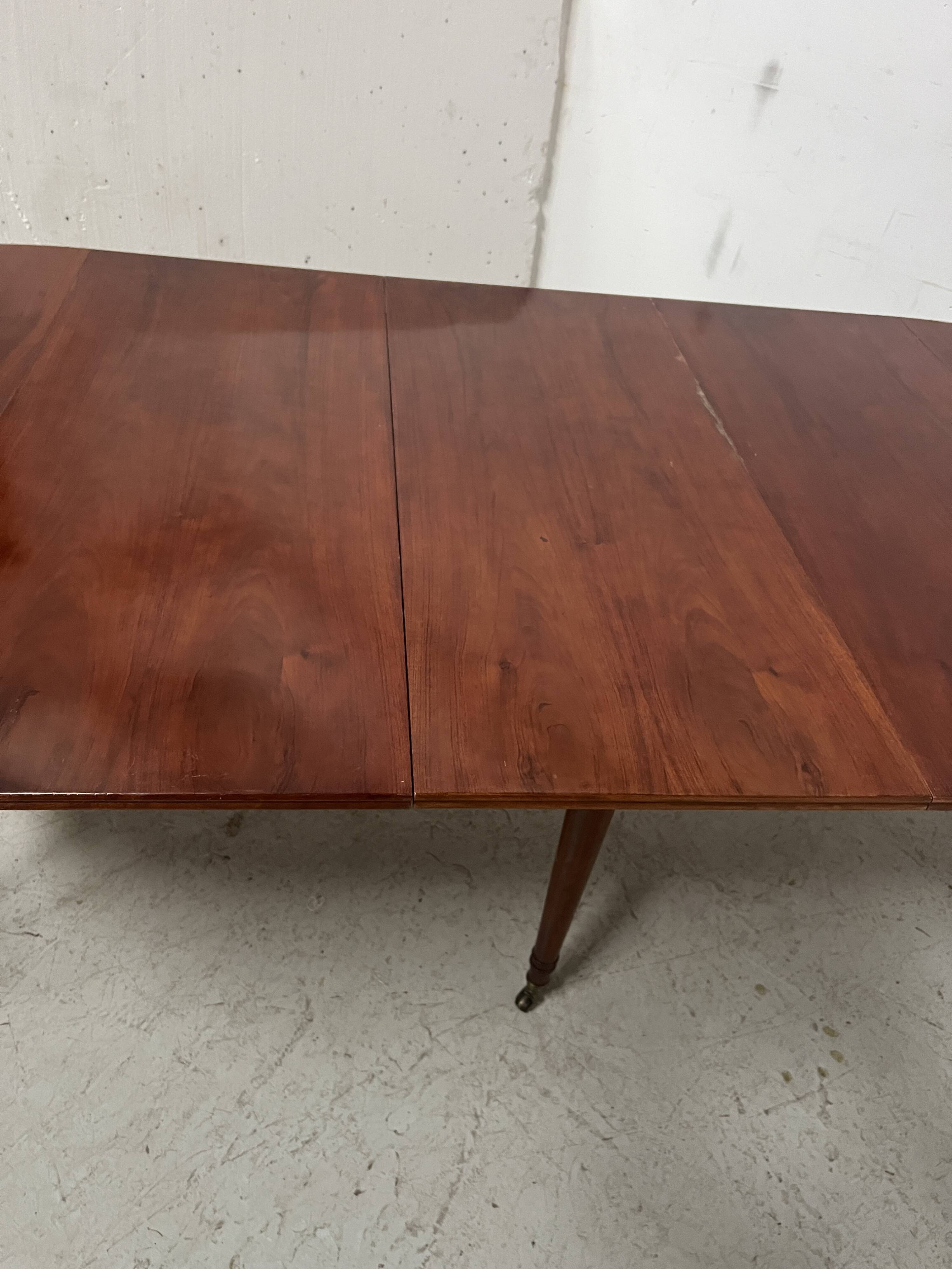 A six-foot Louis XVI style mahogany table from the 19th century.