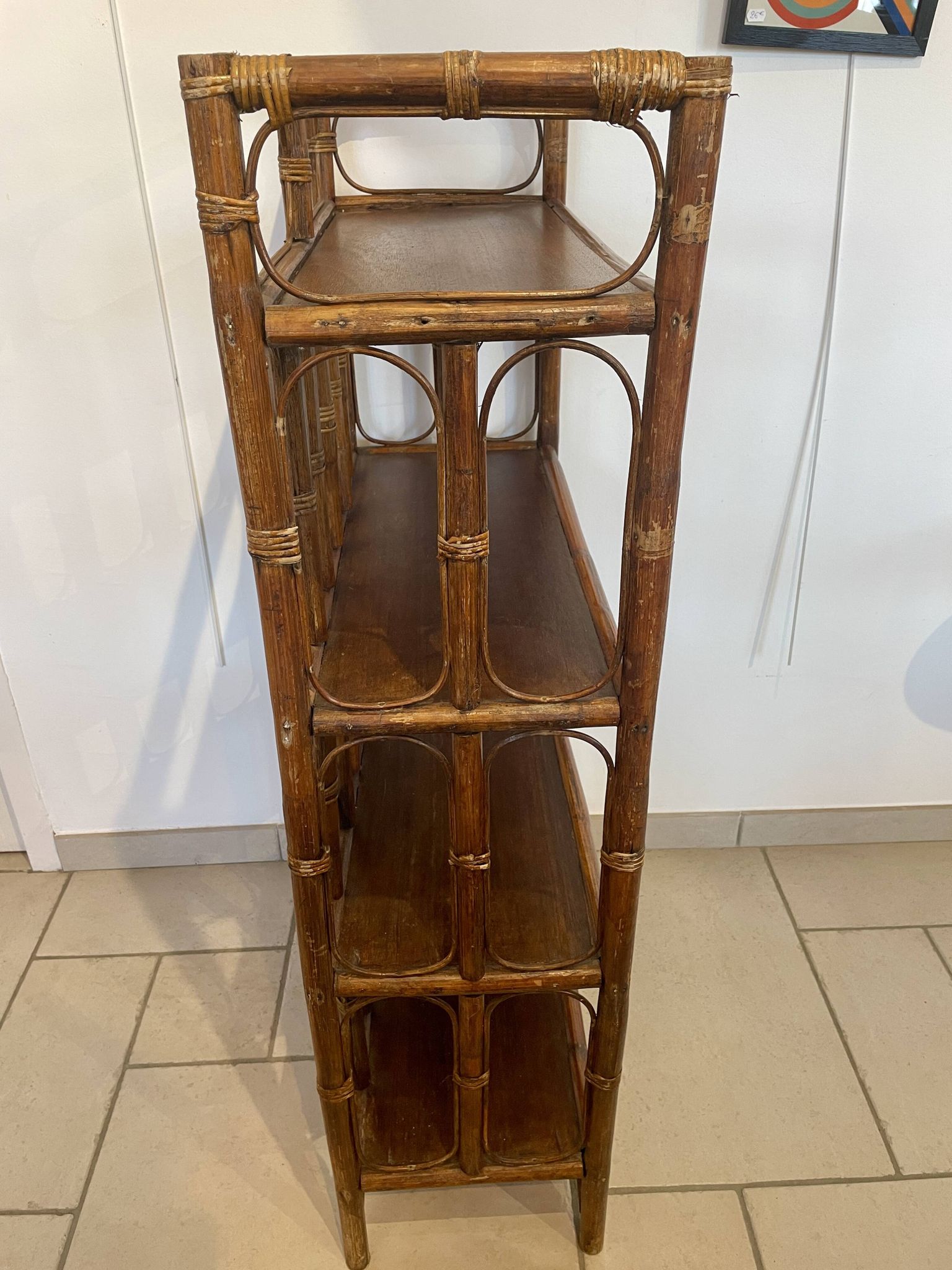 Shelf on rattan and bamboo legs from the 70s