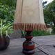 Rustic turned wood table lamp with vintage leather shade