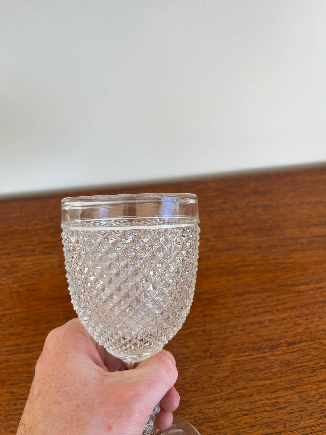 Two 19th-century moulded crystal glasses with diamond points.