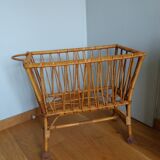 Rattan wicker cradle on wooden wheels