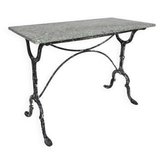 Bistro table, garden table with marble top, glass window in Paris