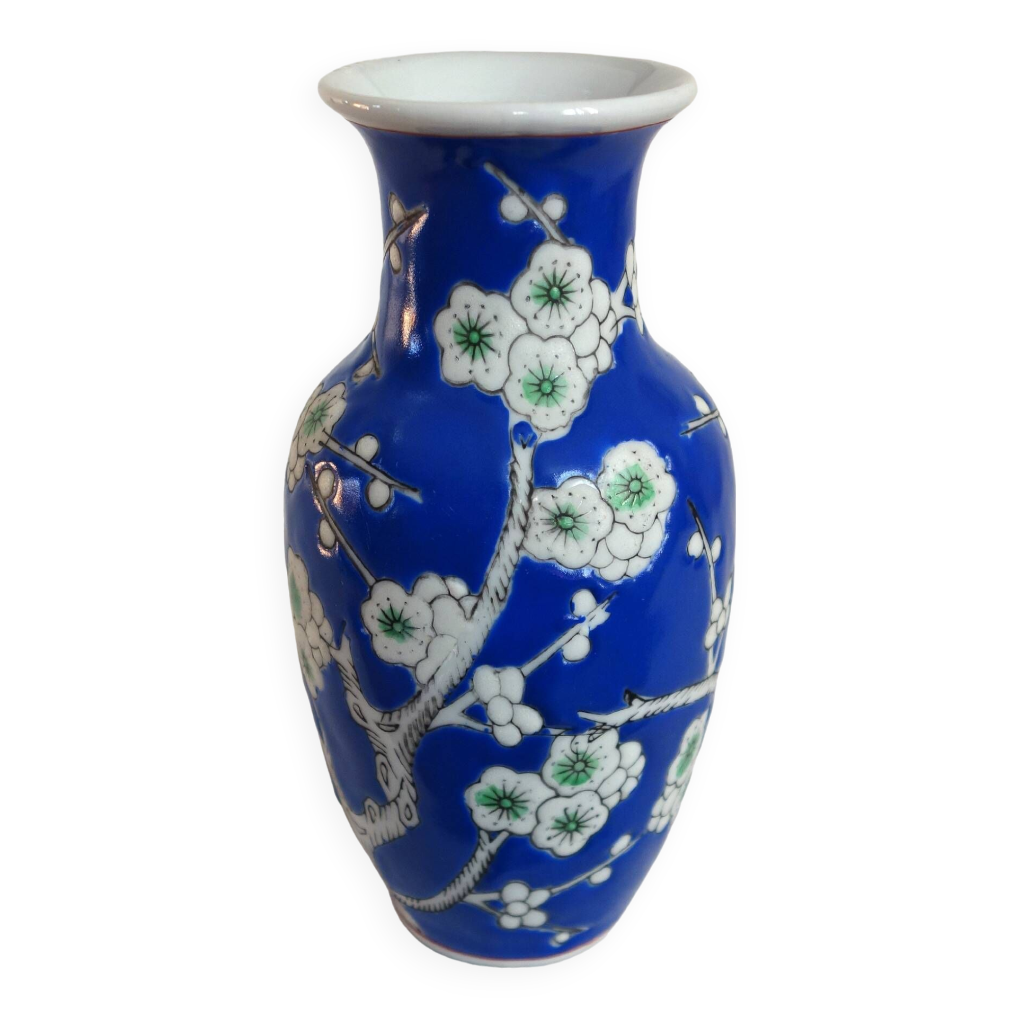 Old blue vase with vintage porcelain cherry blossoms