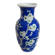 Old blue vase with vintage porcelain cherry blossoms