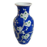 Old blue vase with vintage porcelain cherry blossoms