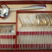 Silver cutlery set for 36 place settings and its ladle.