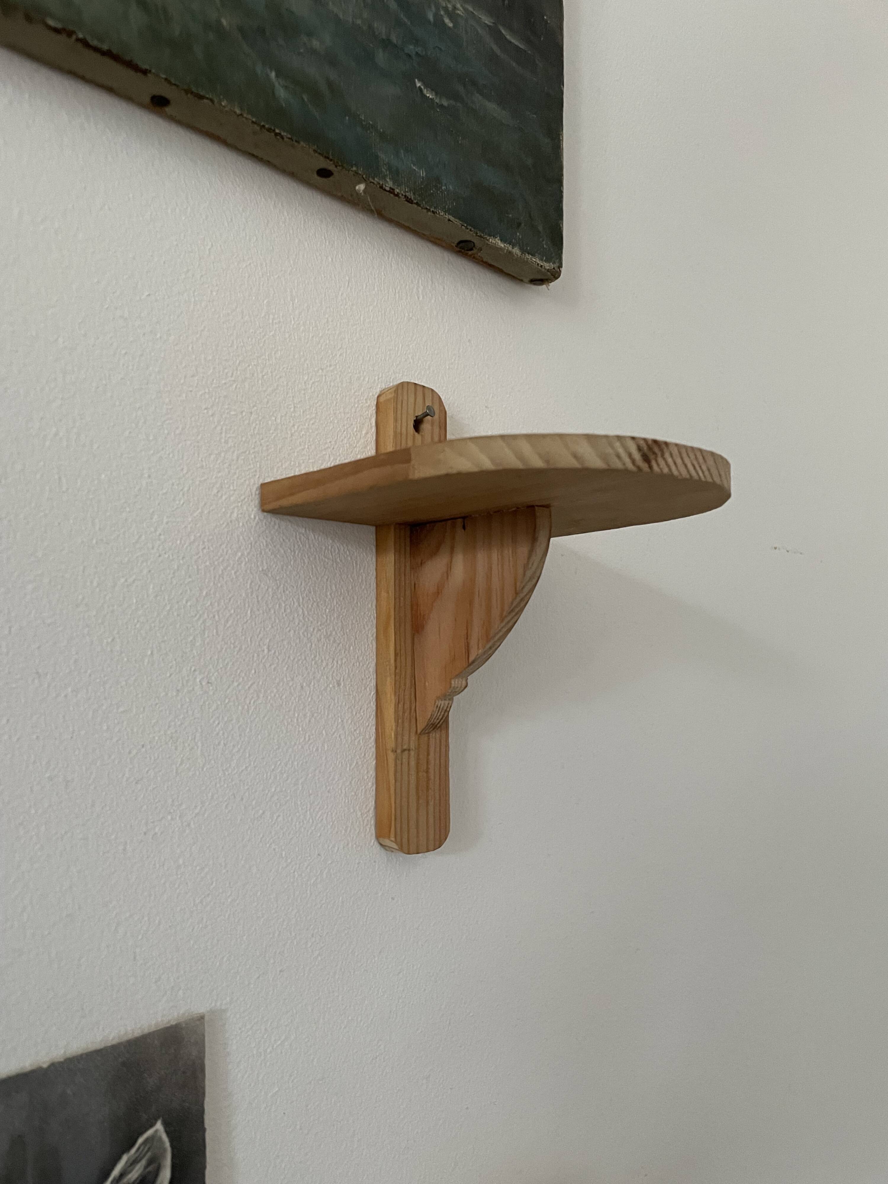 Small wall-mounted wooden shelf