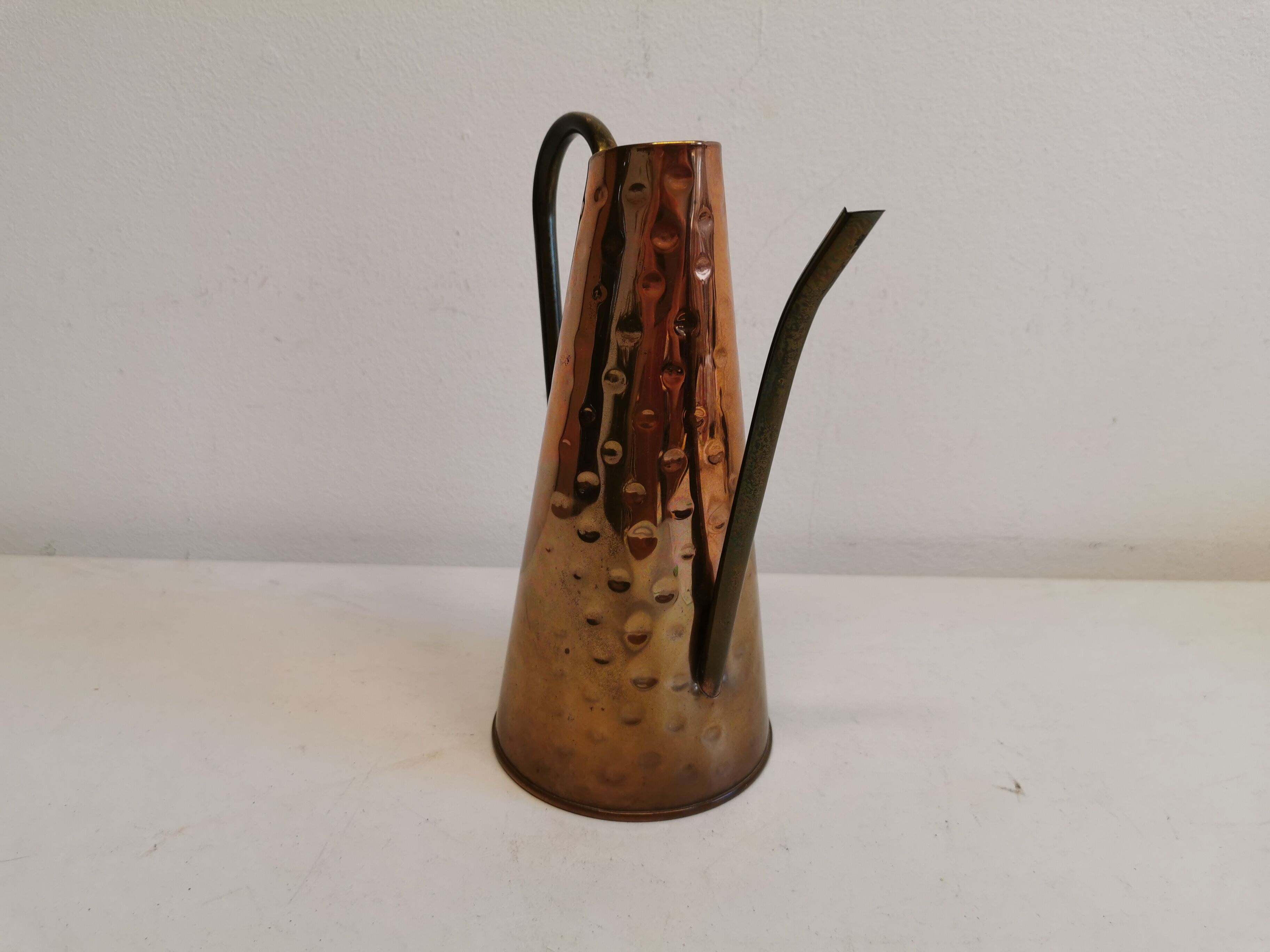 Watering can from the 1950s, made of hammered copper and brass