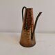 Watering can from the 1950s, made of hammered copper and brass