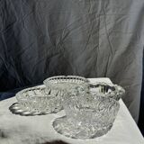 Circular glass ashtray with stylized petal patterns